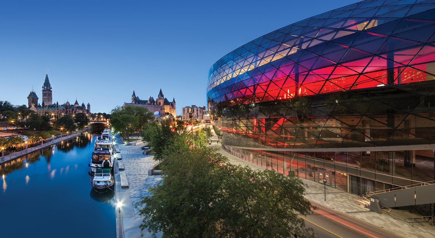 The Shaw Centre overlooks the Rideau Canal at dusk.