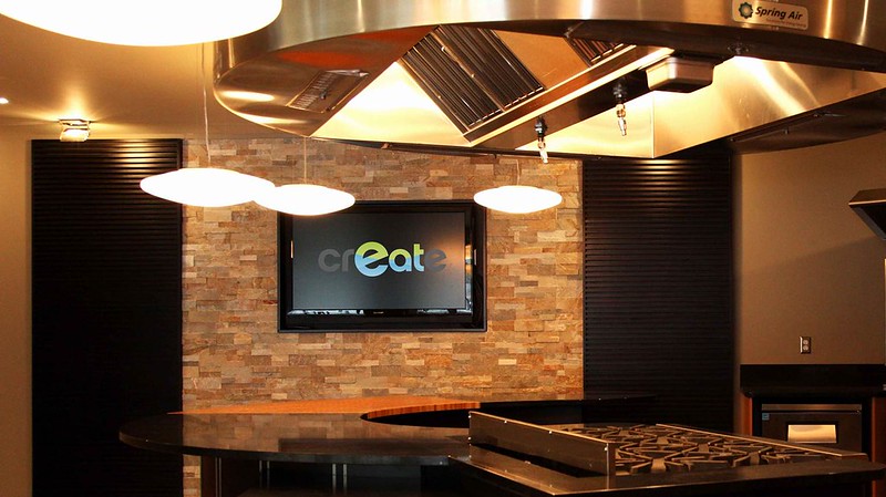 The crEATe Kitchen's interactive cooking and service area.
