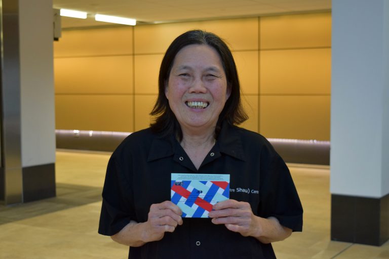 female holding a gift card