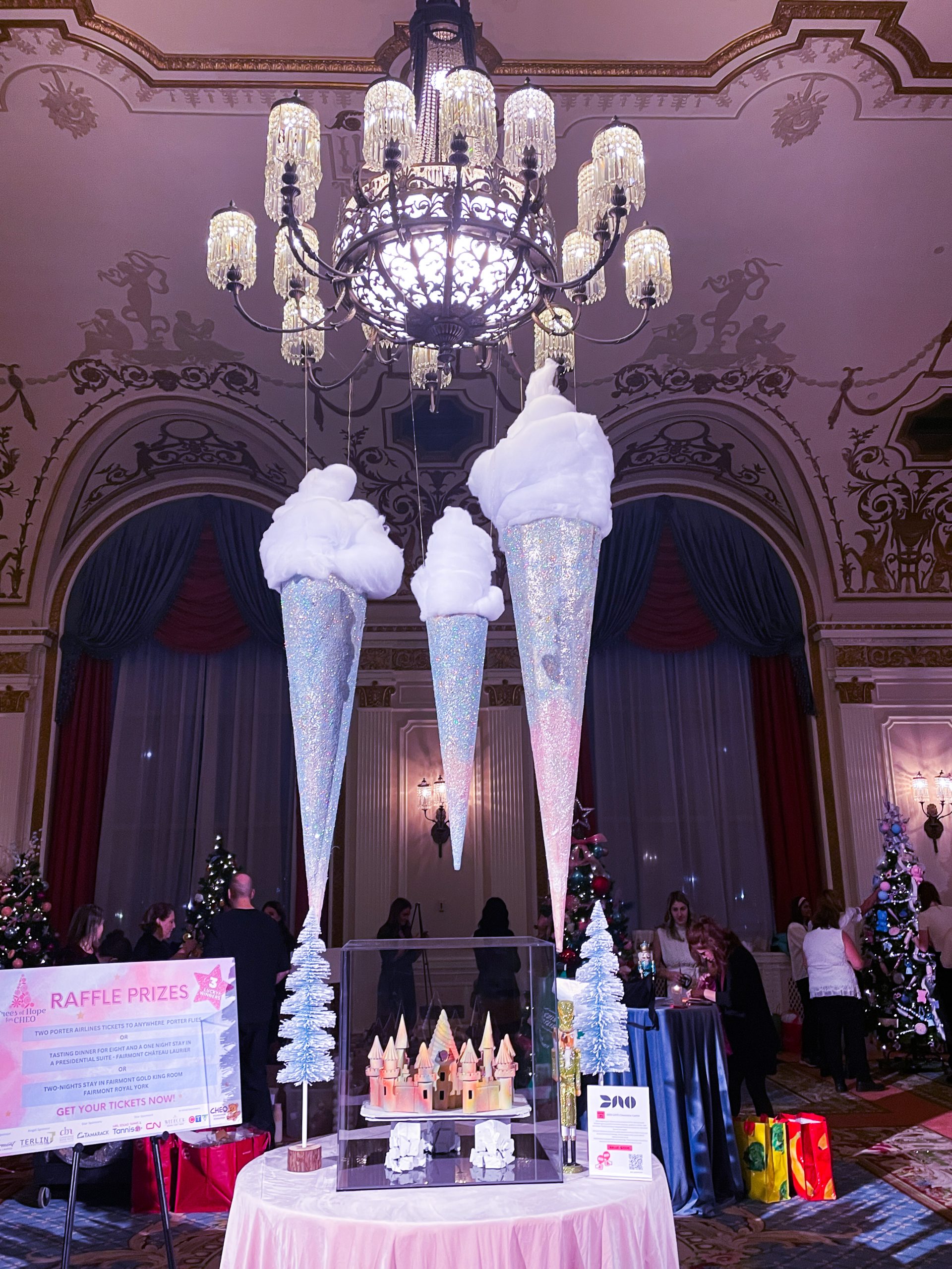 Giant ice cream cones hang from chandelier with custom chocolate castle replication of Fairmont Chateau Laurier