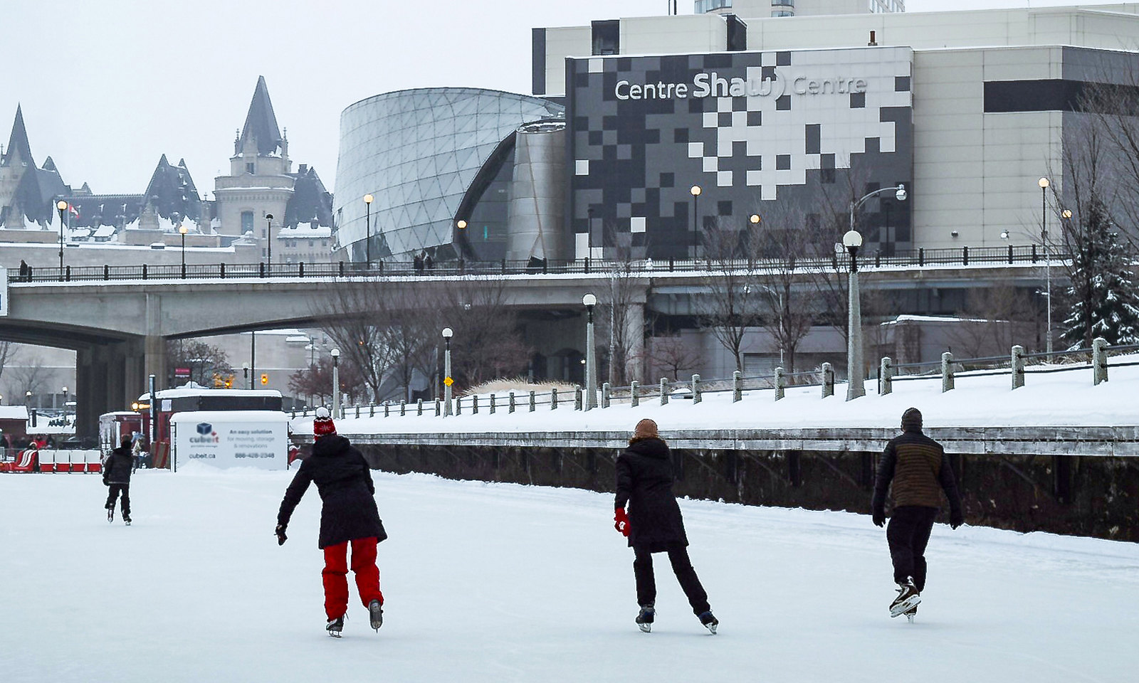 Skaters on the Rideau Canal near Shaw Centre and Mackenzie King Bridge